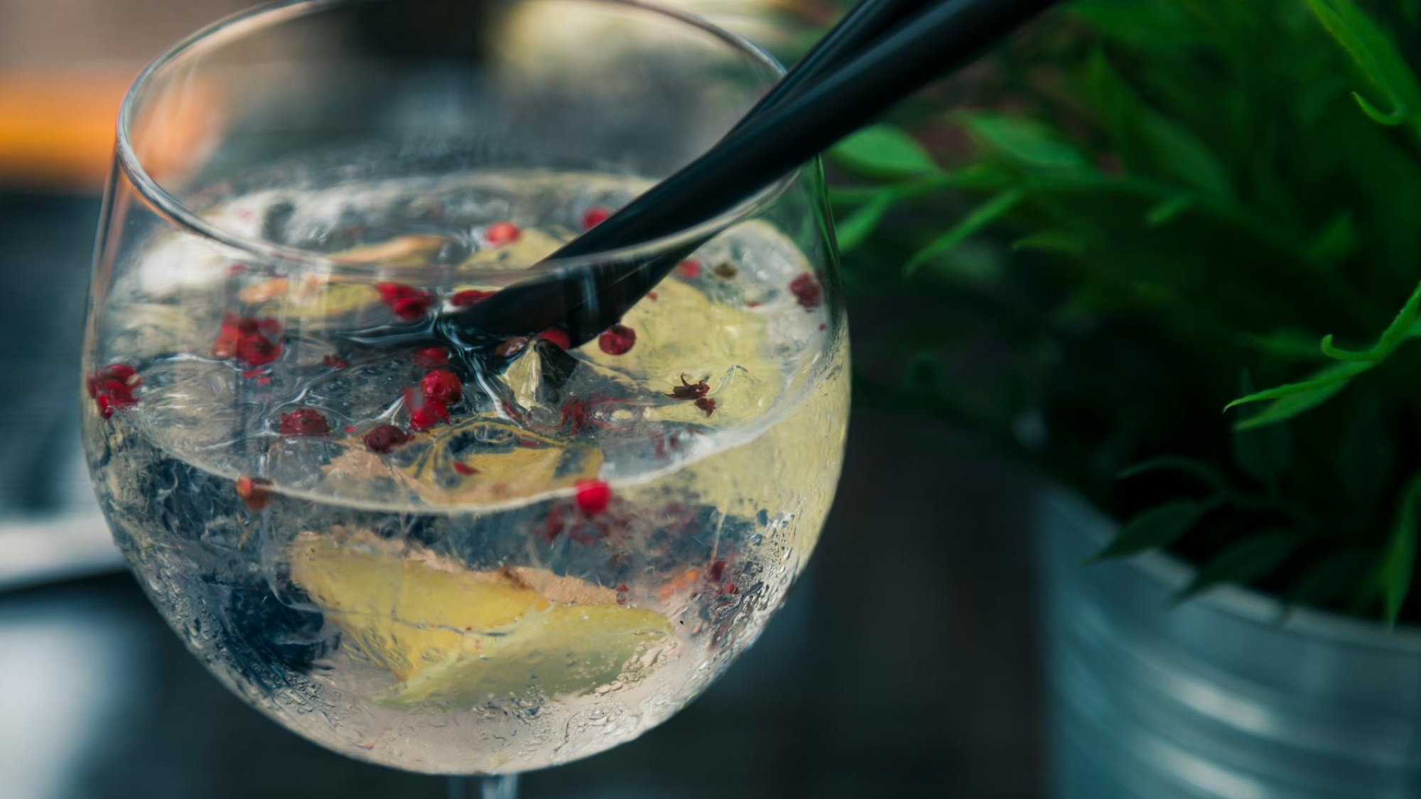 clear wine glass with liquid in focus photography