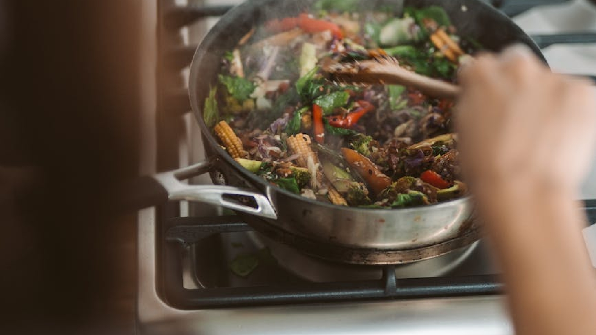 person cooking on black pan